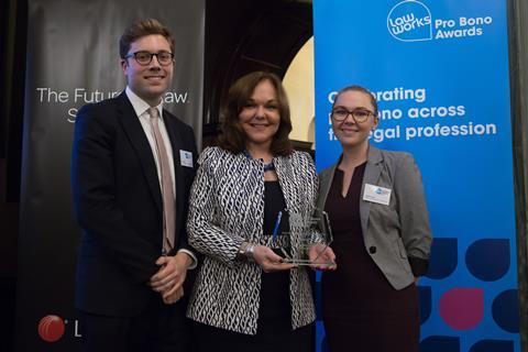 Best Contribution by an International Firm  Bryon Spring and Natalie Farmer, Cleary Gottlieb Steen & Hamilton LLP, receiving the award from Hilarie Bass (President, American Bar Association)